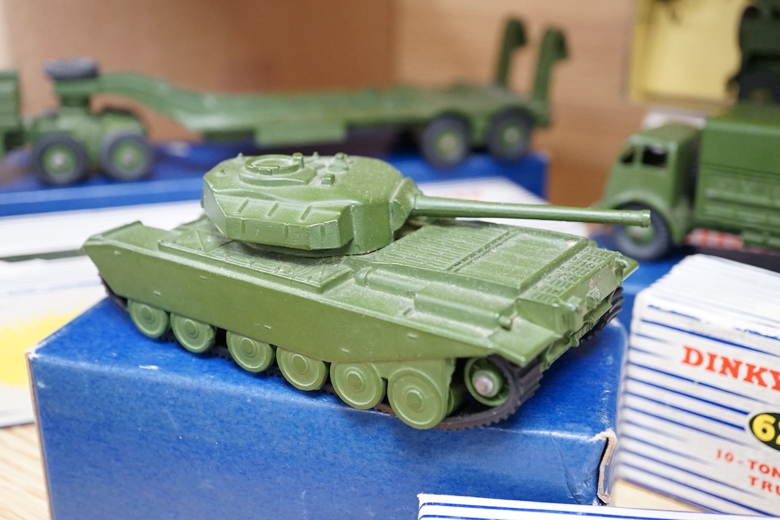 Four boxed Dinky Toys military vehicles; Mighty Antar tank transporter (660), Centurion tank (651), Recovery Tractor (661), and 10-ton Army Truck (622). Condition - fair to good, vehicles generally very good, minor wear